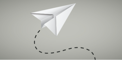 White paper airplane with dotted flight path